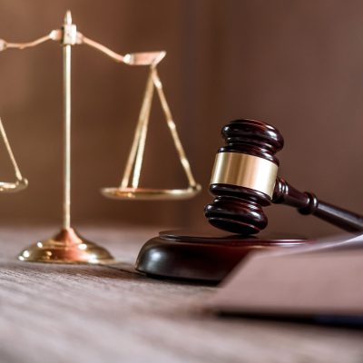 Scales of justice and Gavel on wooden table and agreement in Courtroom, Justice and Law concept.
